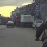 SEE IT: Man rides on bicycle — with goat on his back — in Ethiopia